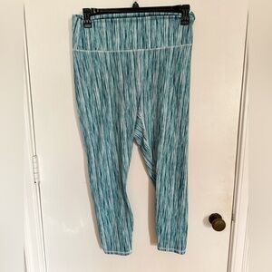 Fabletics PowerHold® High Waisted 7/8 Legging in
Rush Print XL